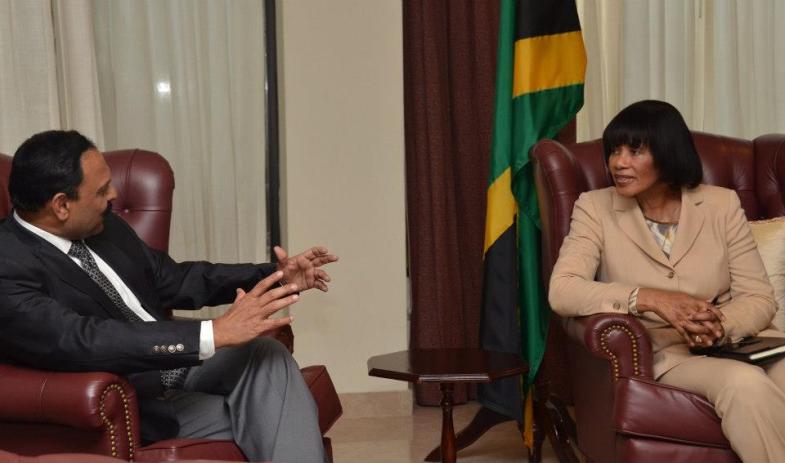  Prime Minister Portia Simpson Miller in dialogue with Mr. K. S. Kumar, Head of Operations at Sutherland Global Services during a courtesy visit at the Office of the Prime Minister on Thursday, January 3, 2013.